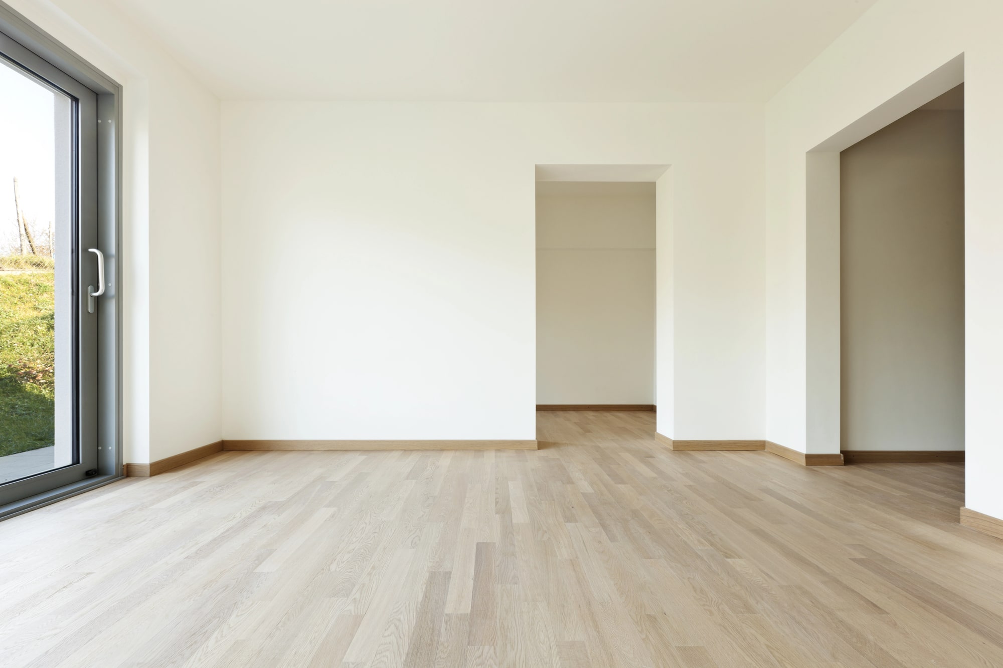 Empty room with light hardwood flooring